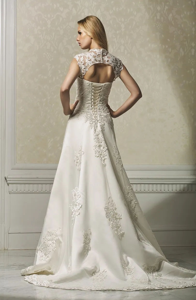 ---Catalog 2021 wedding dress made in satin and tulle with lace inserts decorated with sparkling stones--