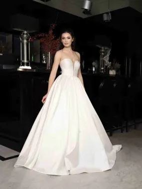 ---Mikado wedding dress, elegant V-neck bodice, defined by an A-line skirt, zip and button closure, chapel train--