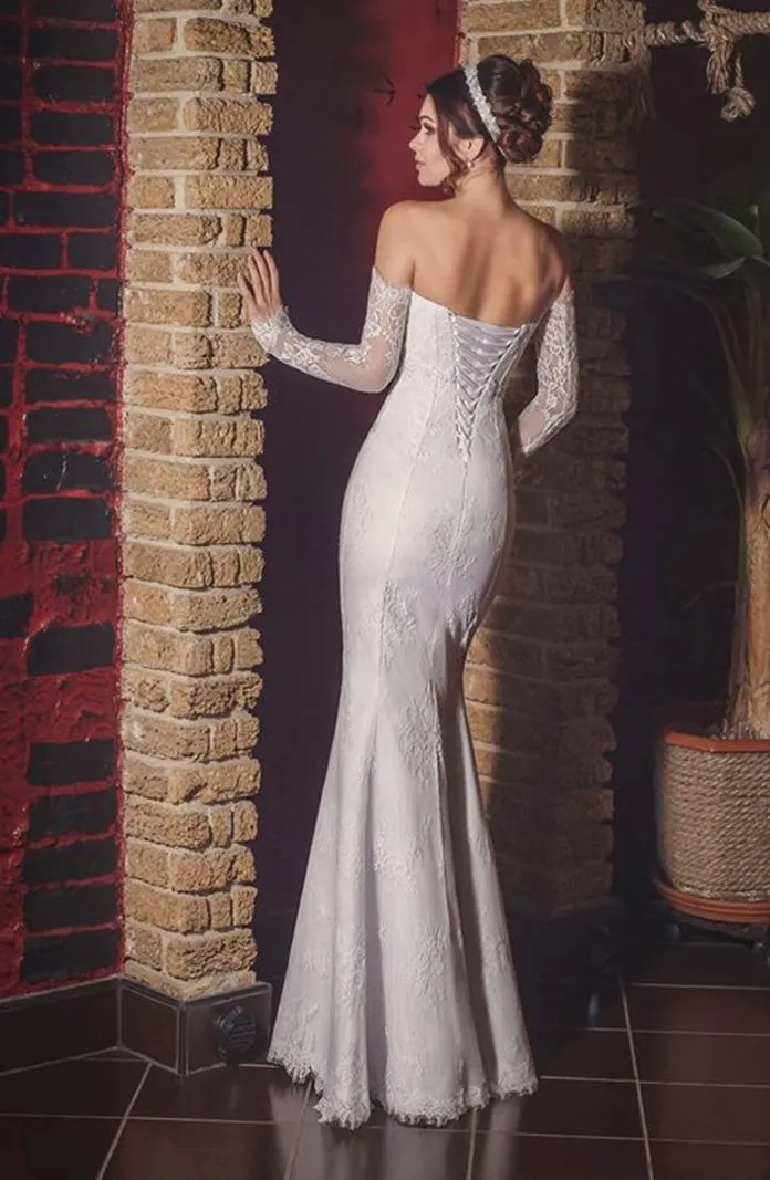 ---Romantic and sensual wedding dress for sale online made in lace with a very fitted silhouette--